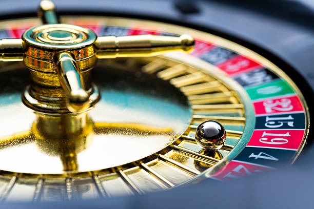 Texas Hold'em Bonus live dealer table on mobile phone showing community cards and betting controls
